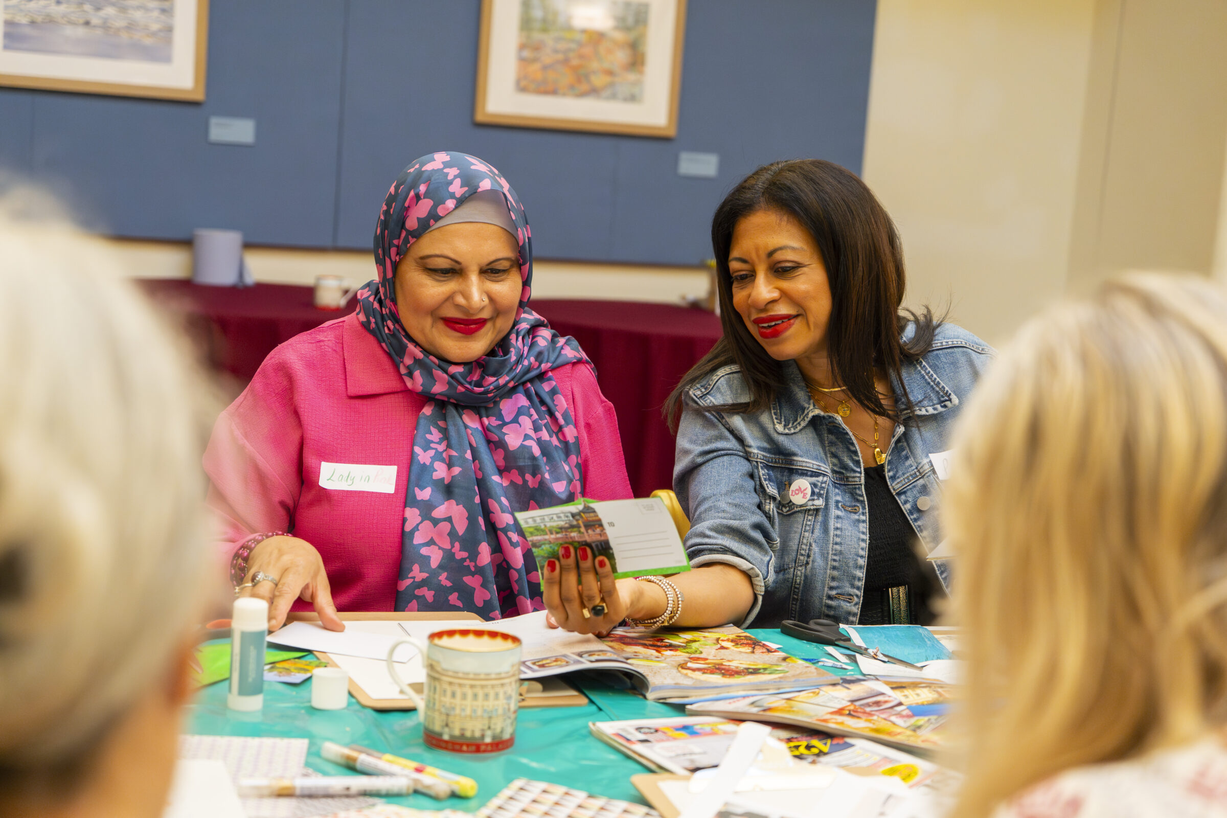 Participants looking at postcards together