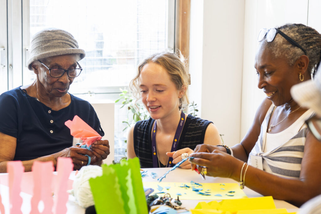 Participants creating paper lace works at Cockpit Deptford