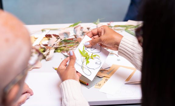 Flowers and natural materials being used to create designs