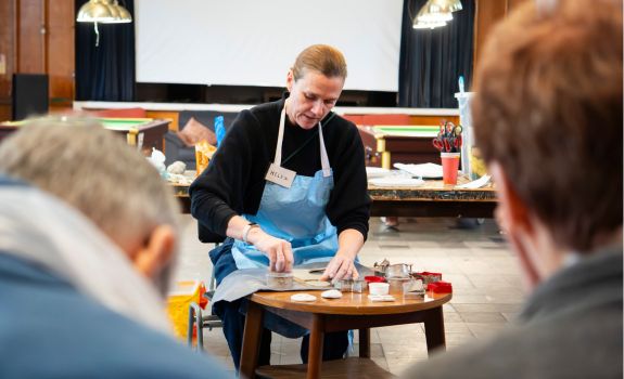 Artist demonstrating creating ceramic decorations