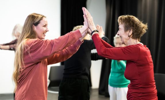 Two participants dancing at Southwark Playhouse
