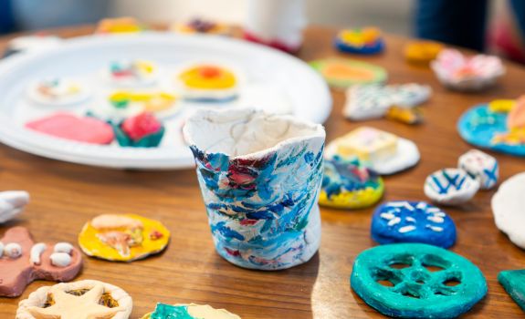 Various pieces of decorated ceramic food and coffee cup