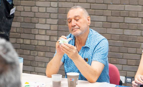 Frank working on a ceramic bird