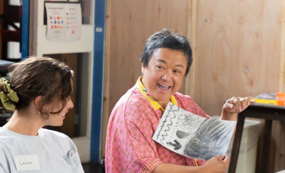 Participant holding drawings of shells during the first programme at SET Social in Peckham