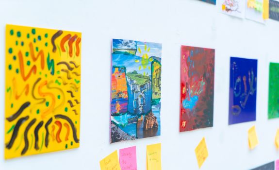 Bright and colourful artworks created by participants on display at the CSM exhibition