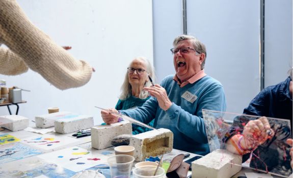 Participant laughing heartily at a CSM workshop