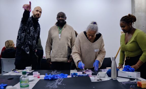Participants and students creating and engaging during a workshop with CSM