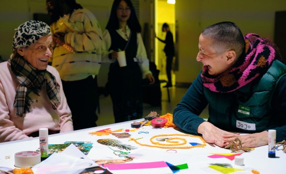 Companion and participant sharing a launch together at the CSM workshop