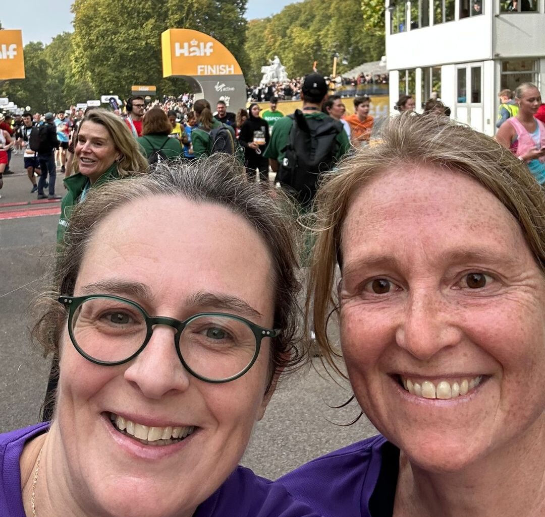 A selfie of Julie and her friend happy, smiling together on the Royal Parks Half Marathon course