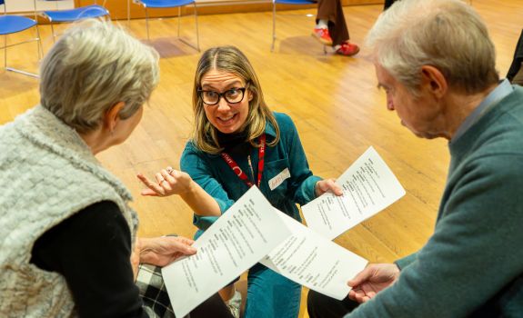 Actor Gabi working with participants on scripts during the Globe programme